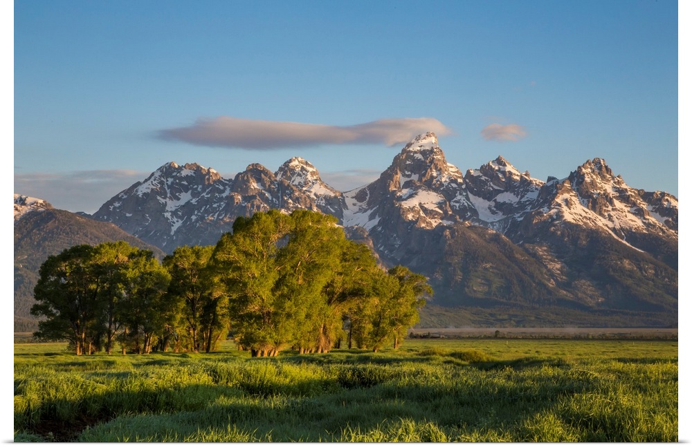 USA, Wyoming, Grand Teton National Park, a small cloud hits the top of the Grand Teton in the springtime.