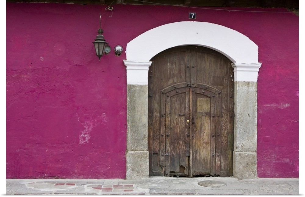 Central America, Guatemala, Antigua.  Ornate wooden doors of home in the town of Antigua.