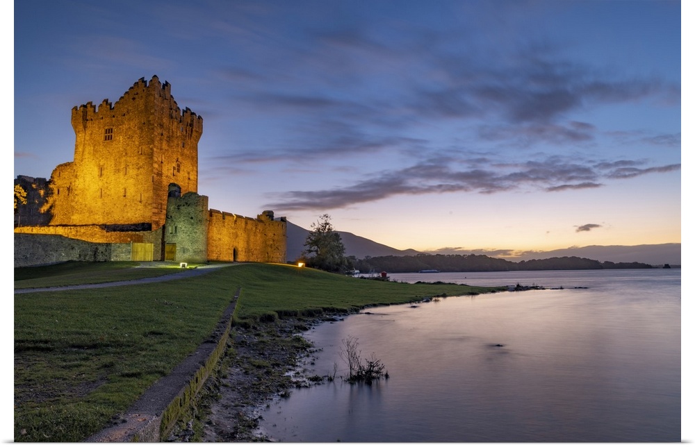 Historic Ross Castle at dusk in Killarney National Park, Ireland.