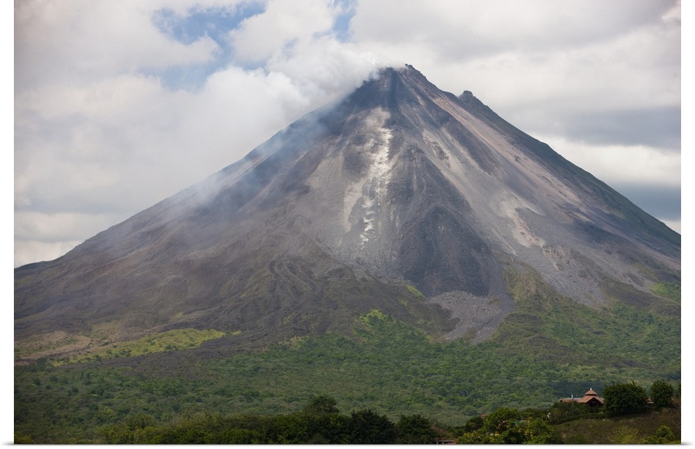 Lava rocks are thrown from the erupting Arenal volcano to the mountainside and forest below in Arenal, Costa Rica.