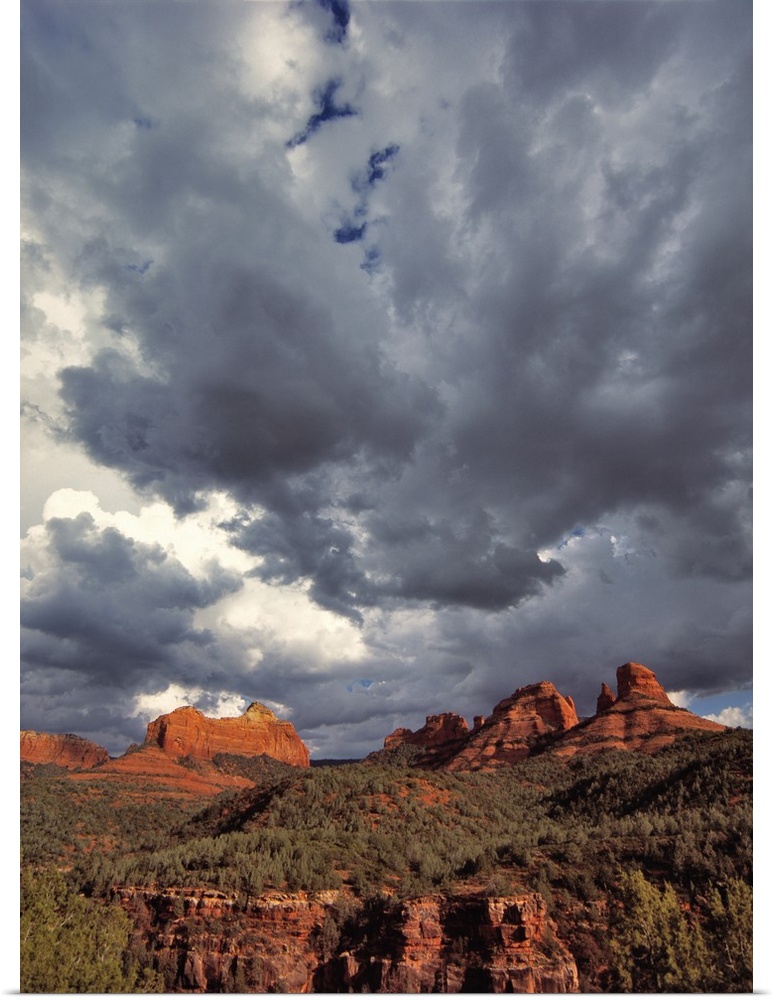 USA, Arizona, Oak Creek Canyon. Menacing clouds race through the red rocks of Oak Creek Canyon in Arizona.