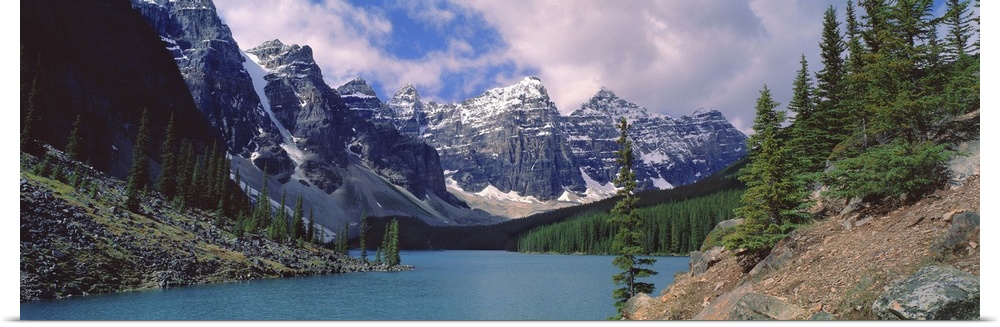 Canada, Alberta, Moraine Lake. Clouds hide the peaks of Moraine Lake in the Valley of the Ten Peaks in Banff NP, a World H...