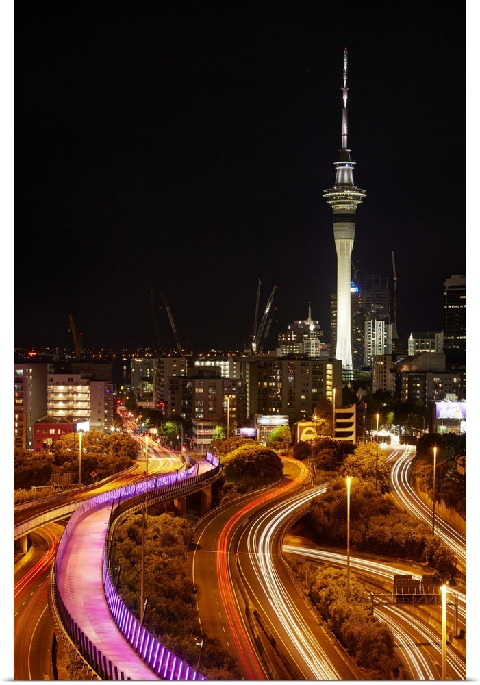 Motorways, Light path cycleway, and sky tower at night, Auckland, North Island, New Zealand.