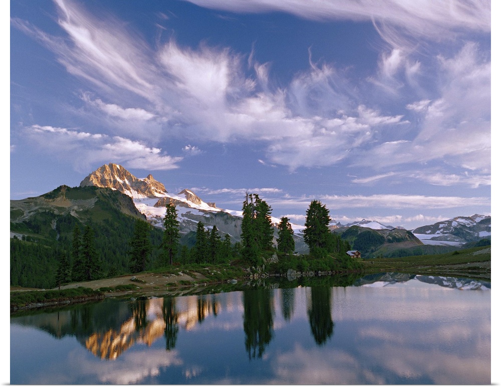 Under a sky of wispy clouds, Mount Garibaldi towers over Elfin Lakes in Mount Garibaldi Provincial Park, British Columbia,...