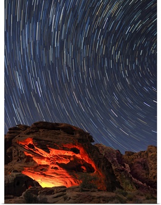 Nevada, Valley Of Fire State Park, Star Trails And Campfire Glowing In Sandstone Rocks