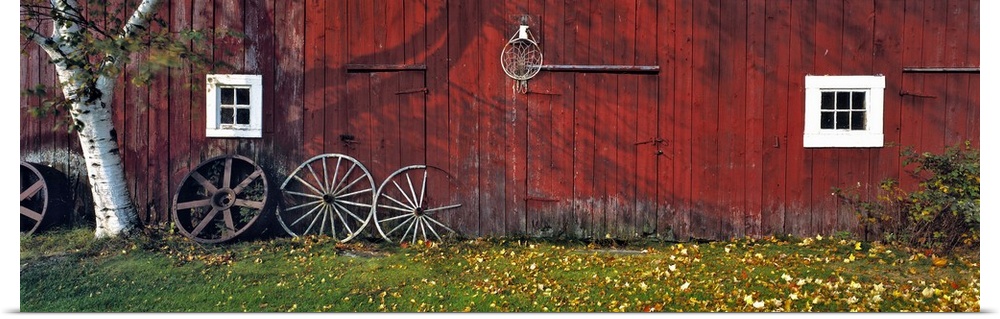 USA, New Hampshire, Franconia Notch. Autumn color enhances the deep red siding of an old barn near Franconia Notch, New Ha...