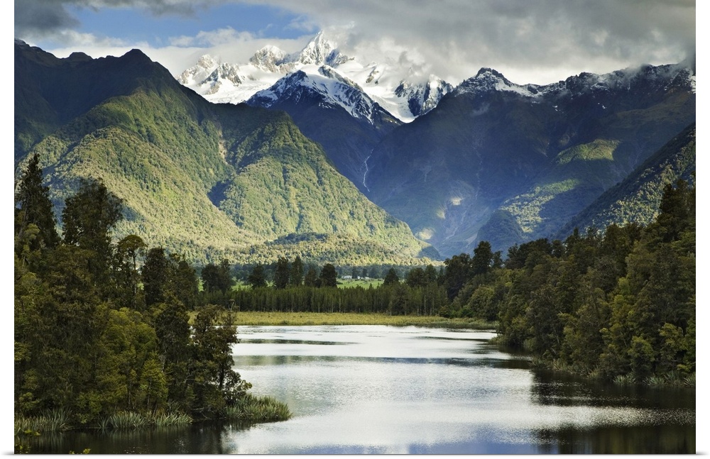 New Zealand, South Island. Cloud-shrouded Mt. Cook as seen from Lake Matheson near the town of Fox Glacier. Credit as: Den...