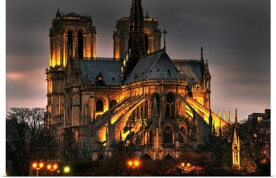 Notre Dame Cathedral And The Seine River Shimmer In The Paris, France, Night