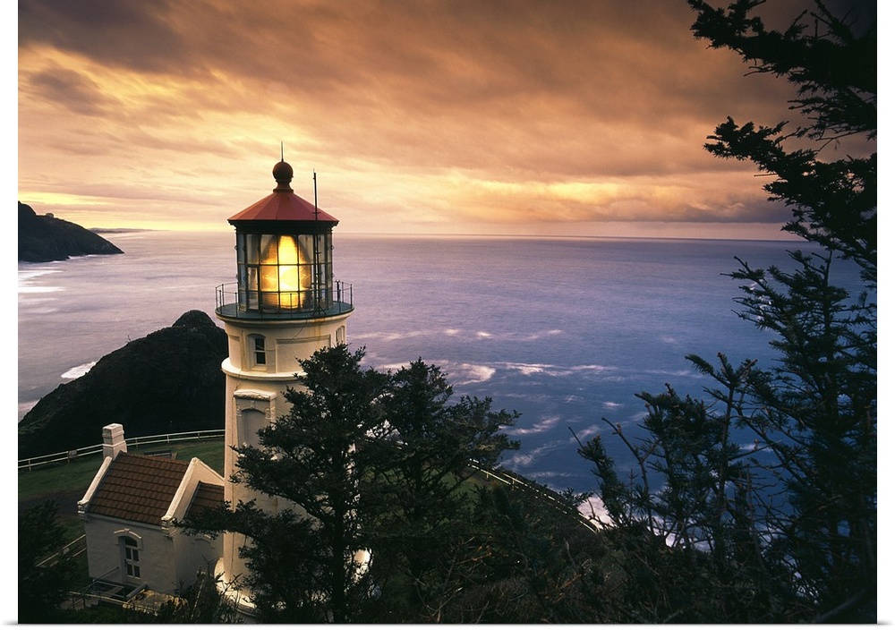 Oregon, View of Heceta Head Lighthouse at sunset.