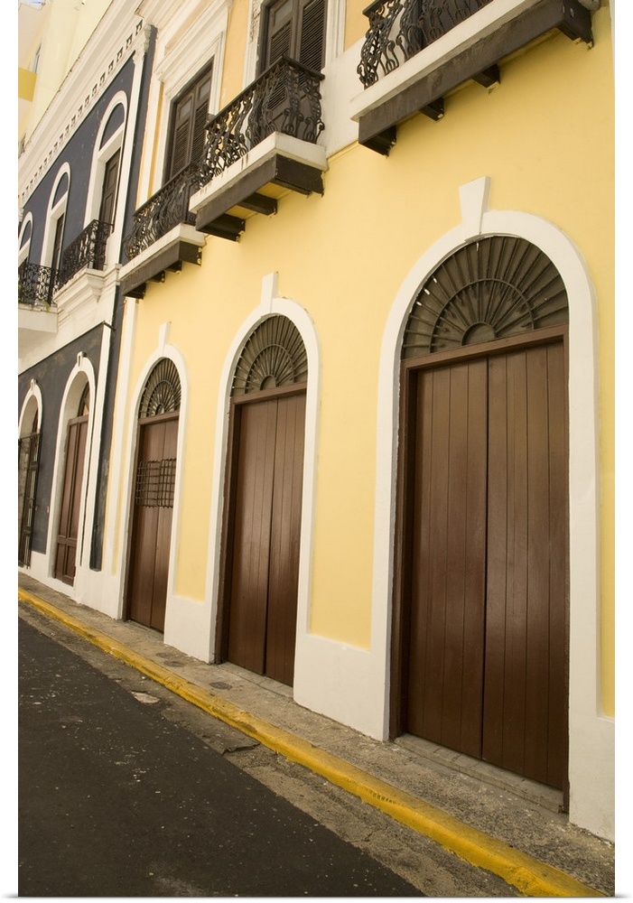 Caribbean, Puerto Rico, Old San Juan.  Traditional architecture with arched doors and wrought-iron balconies.
