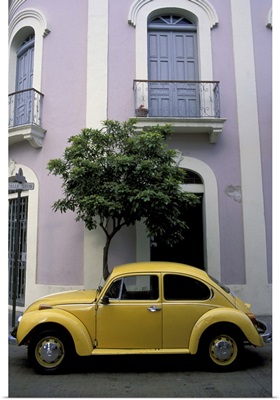 Puerto Rico, Ponce, 19th century pink and white house with yellow VW Beetle