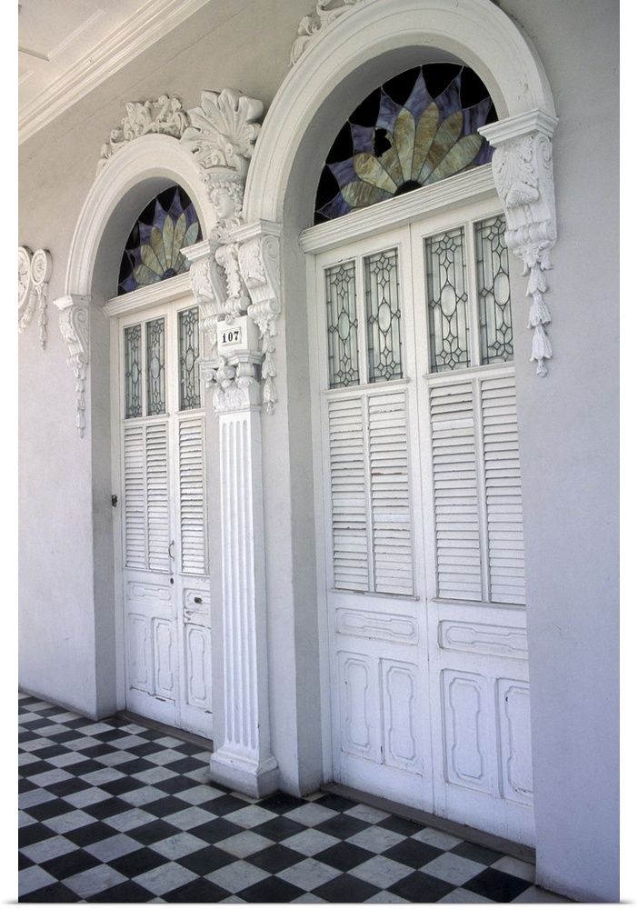 Puerto Rico, Ponce. Historic District and houses from 19th Century; doors with stucco decorations and black and white tile...