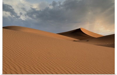 Sand Dunes Glow Orange At Sunset In The Sahara Desert