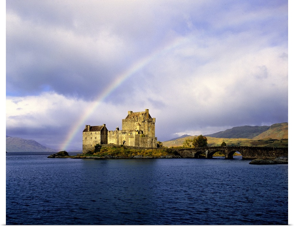 Scotland, Highland, Wester Ross, Eilean Donan Castle. A rainbow frames beautiful Eilean Donan Castle in the Highland of Sc...