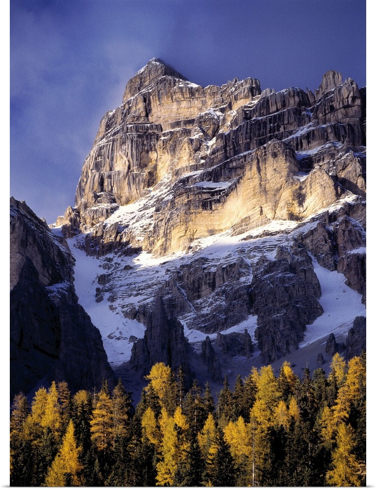 Europe, Italy, Sella Mountains. Sunlight washes a craggy peak near the Sella Group, in Italy's Dolomite Alps.
