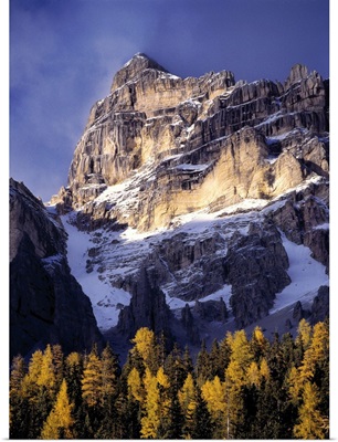 Sunlight washes a craggy peak near the Sella Group, in Italy's Dolomite Alps.