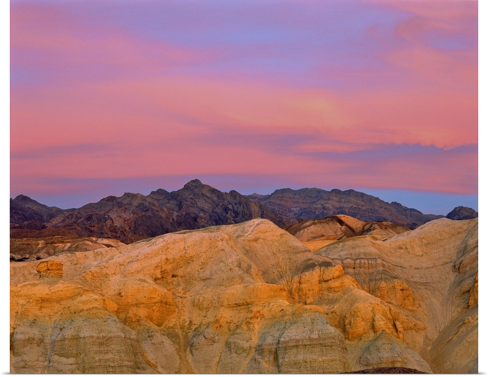 California, Death Valley National Park. Sunset colors the sky with vibrant pink and purple in Death Valley National Park, ...