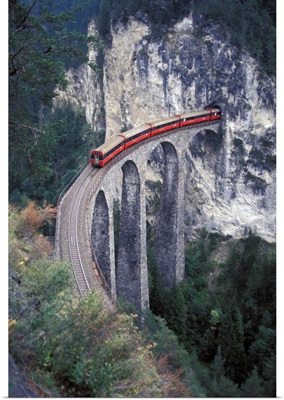 Switzerland, Passenger Train On The Tallest Rock Bridge In Switzerland