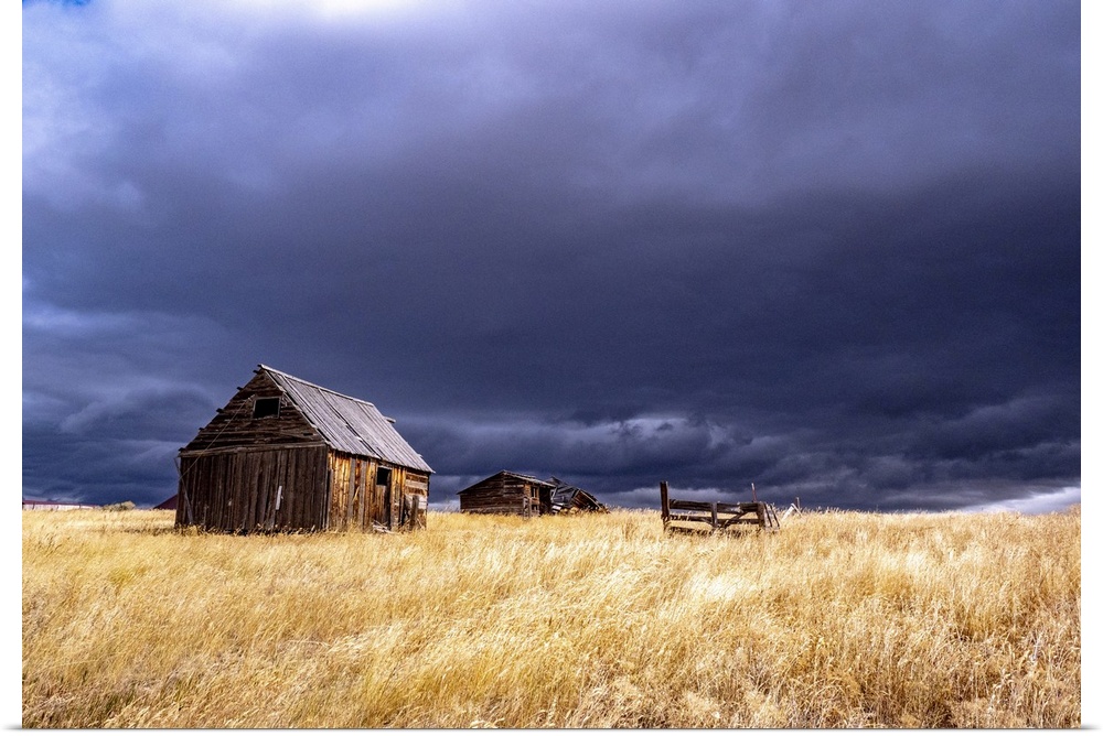 USA, Idaho, Highway 36, Liberty storm passing over old wooden barn. United States, Idaho.