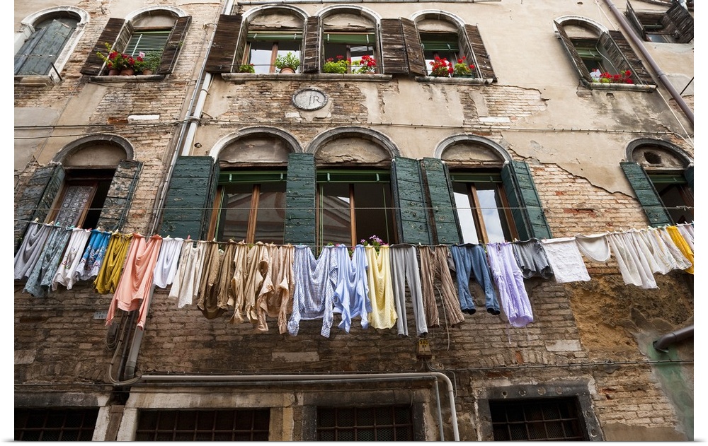 Venice, Veneto, Italy - Laundry is hanging on an outside clothesline to dry in an apartment neighborhood. Horizontal shot.