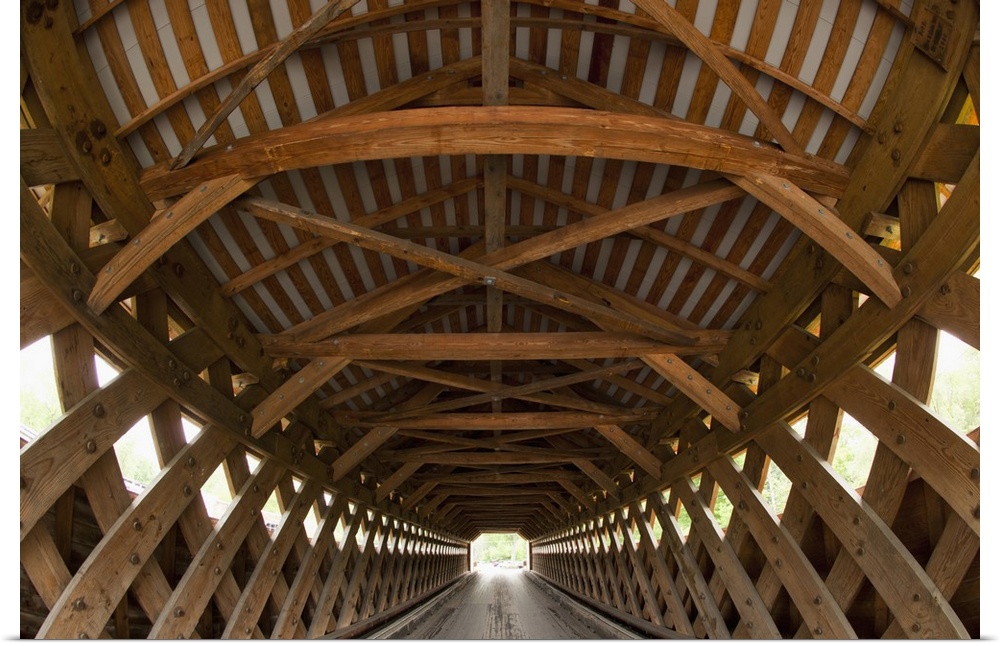 USA, Vermont, Bennington, patterns of wooden beams inside Paper Milll Covered Bridge on a spring morning.
