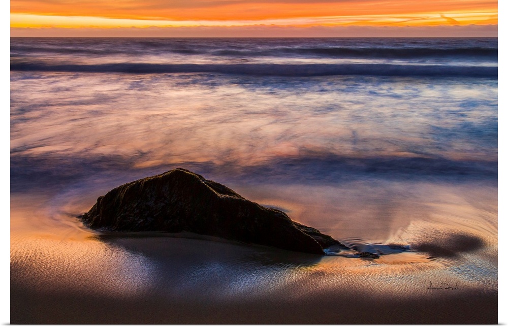 Rocks & Ocean Waves at sunset along the California Coast near Carmel, California, USA.