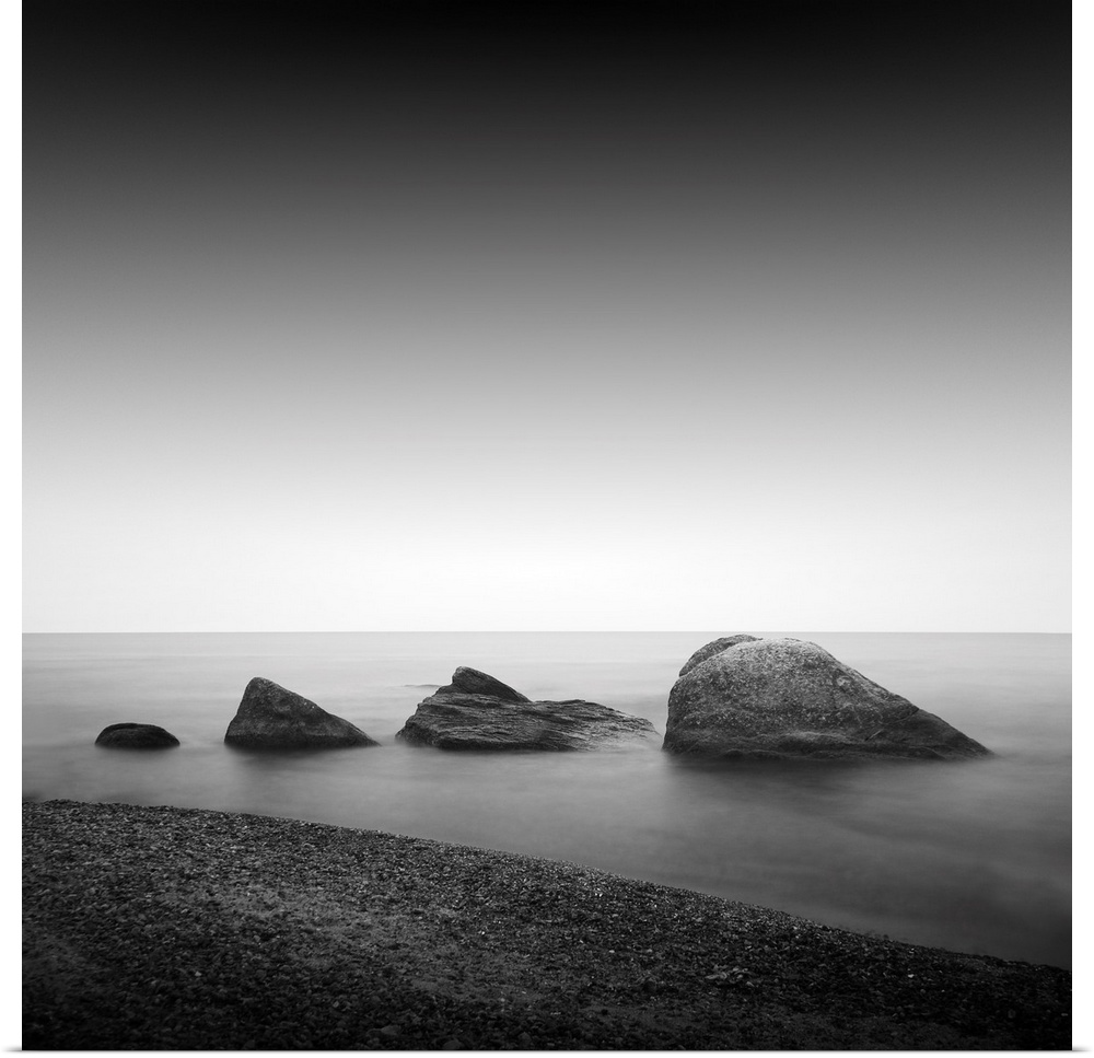 Daytime long exposure seascape with object in the sea. The photo taken in black and white. Black sea, Odessa, Ukraine.