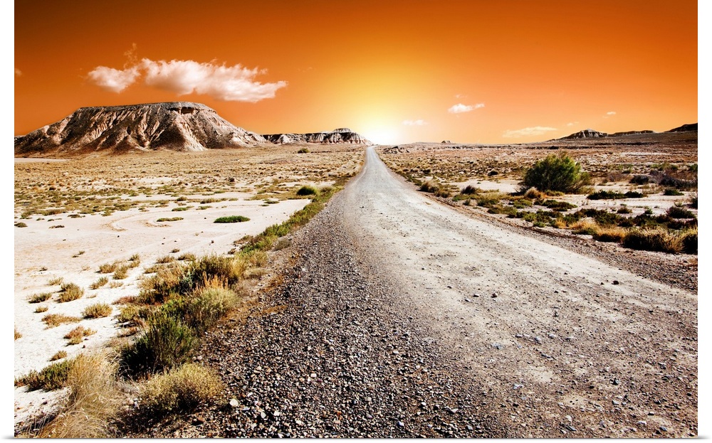 Sunset desert landscape with road.