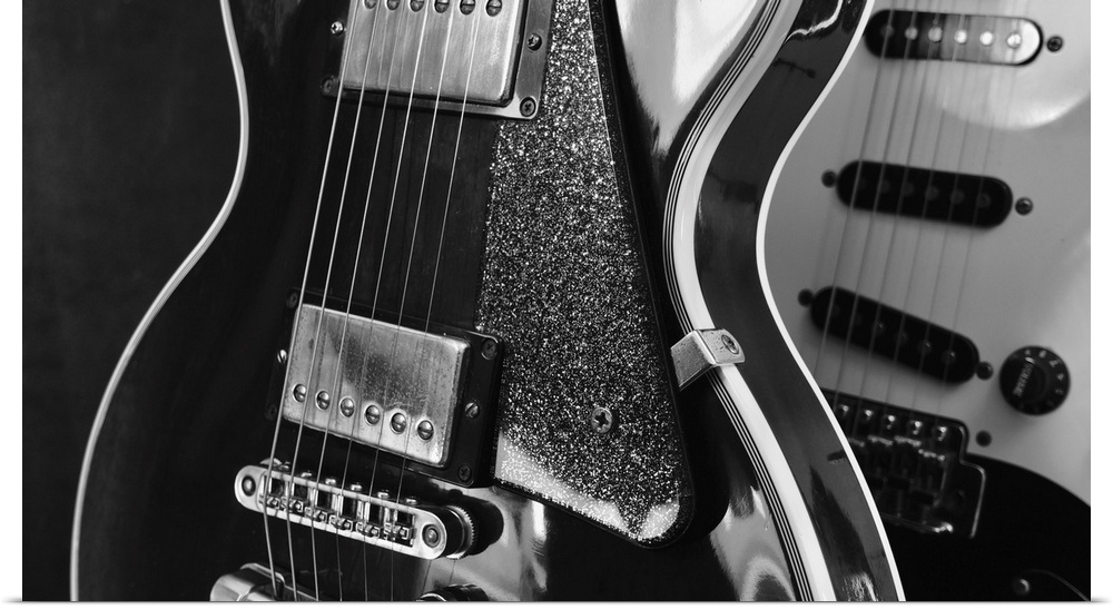 Electric guitar closeup on dark background.