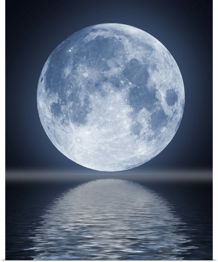 The full moon in the night sky reflected in water.