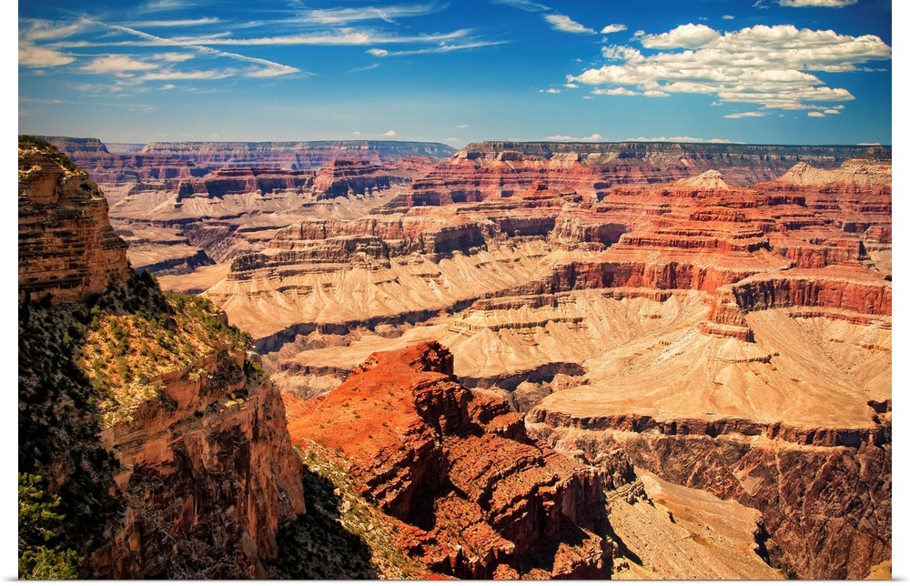 Grand Canyon on a sunny day with blue sky.