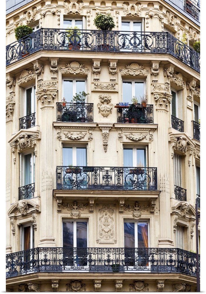 Corner of typical house with balcony in Paris, France.