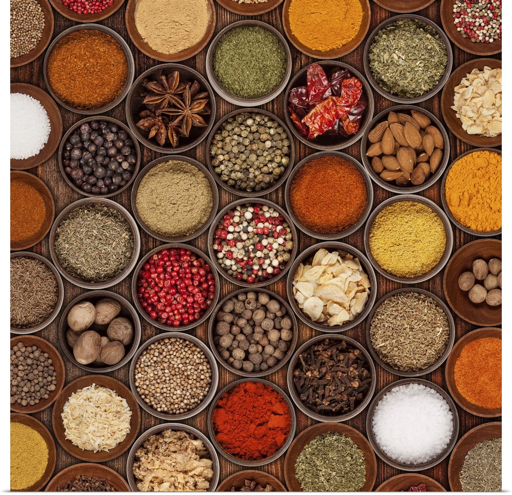 Various kinds of spices on wooden table.
