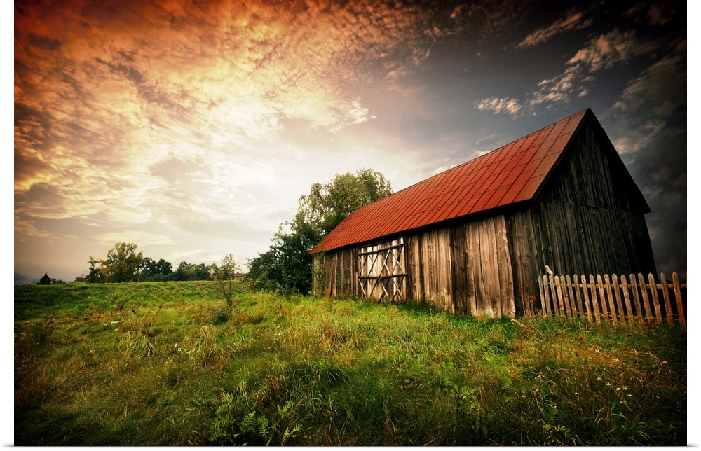 Old wooden bar with red roof over the dramatic sunset in Zalew Zegrzynski, Poland.