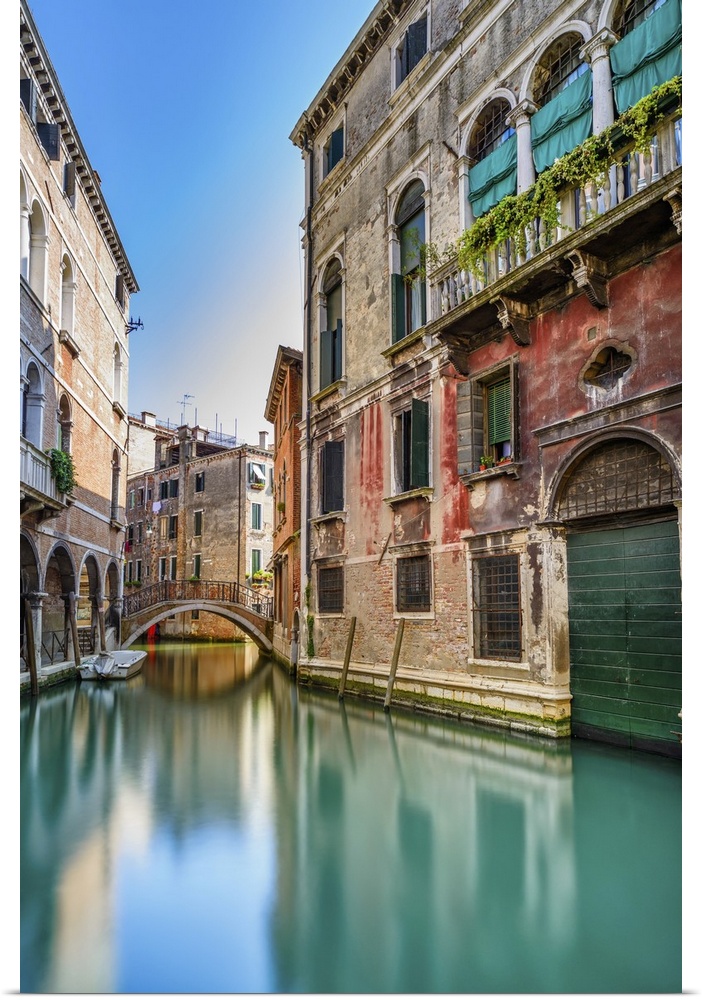 Venice cityscape, narrow water canal, bridge and traditional buildings. Italy, Europe.