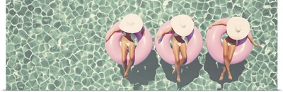 Women In Floats In A Retro Style Pool