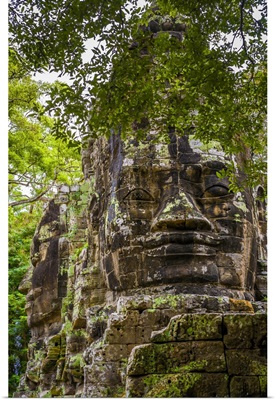 Cambodia, Giant Stone Faces At One Of The Gates Inside The Angkor Thom Temple Complex