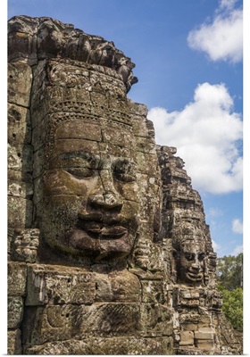 Cambodia, Giant Stone Faces At The Bayon Temple Mountain At Angkor Archeological Park