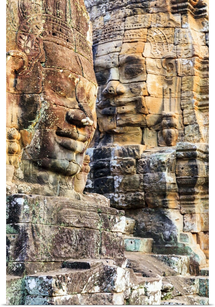 Cambodia, Siemreab, Angkor, Carved Buddha faces in the Bayon Temple.