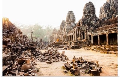 Cambodia, Siemreab, Angkor, Monks leaving the Bayon Temple at sunset