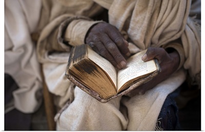 Ethiopia, Amhara, Lalibela, Priest reading an old Bible, Bete Maryam