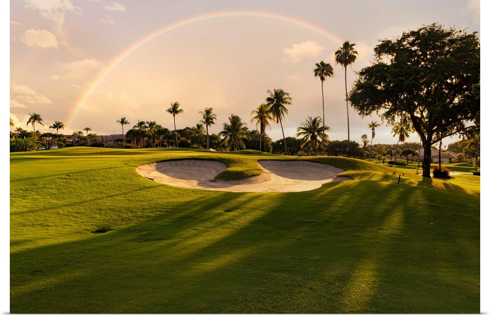 Florida, Boca Raton, golf course with palm trees & rainbow.