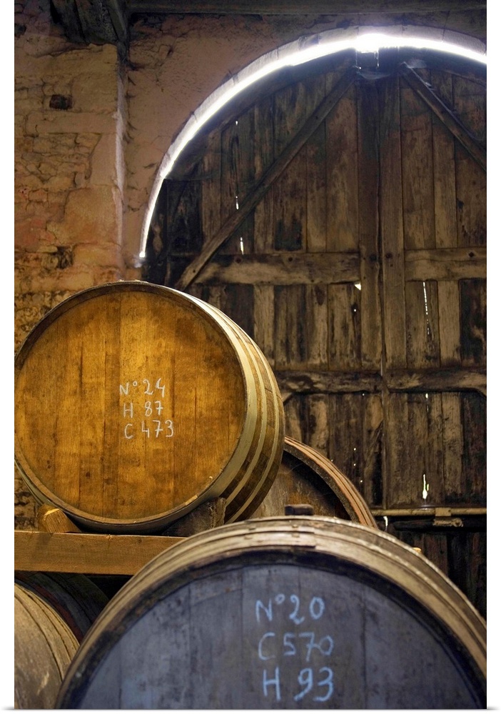 France, Normandy, Calvados barrels in the cellar