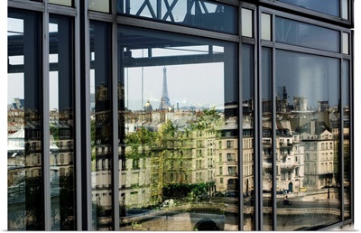 France, Paris, Institut du Monde Arabe with Eiffel Tower reflected on the window