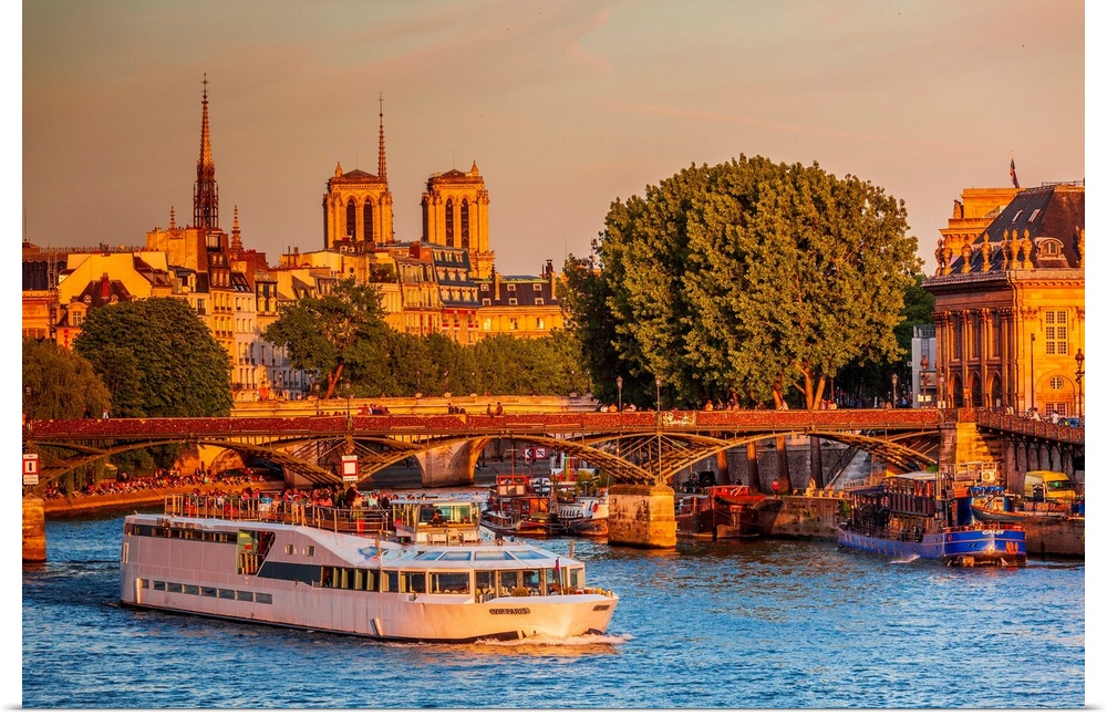 France, Ile-de-France, Seine, Paris, Louvre, Vendome, Pont des Arts, Pont des Arts, Notre Dame de Paris in the background.