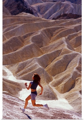 Girl running on desert in Death Valley
