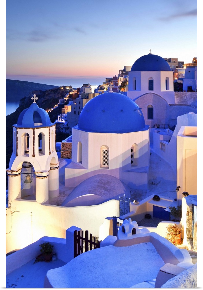 Greece, Aegean islands, Cyclades, Santorini island, Greek Islands, Typical church in Oia village at dusk.