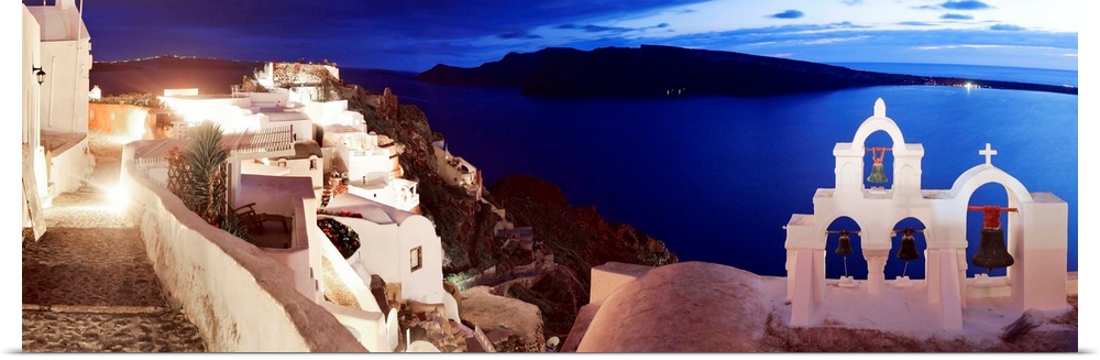 Greece, Aegean islands, Cyclades, Santorini island, Greek Islands, Oia village illuminated at night.