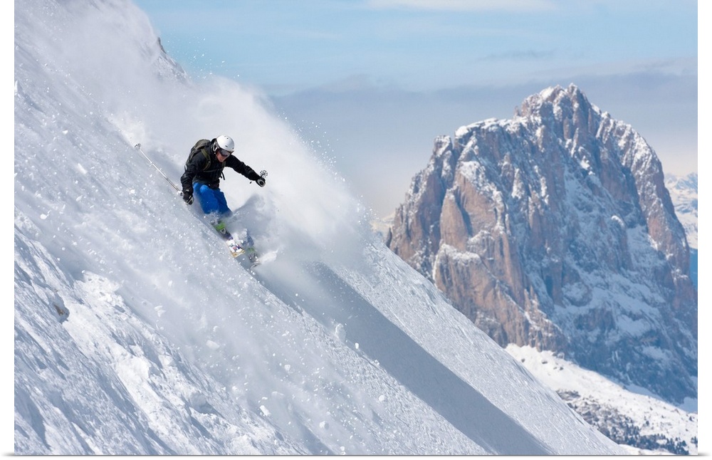 Italy, Veneto, Alps, Dolomites, Belluno district, Freeride ski in Marmolada with Sassolungo Mountain in the background.