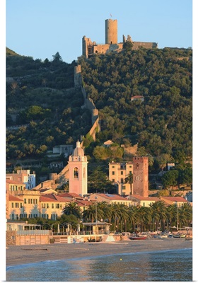 Italy, Noli, Cathedral bell-tower and Castello Ursino on top of the hill